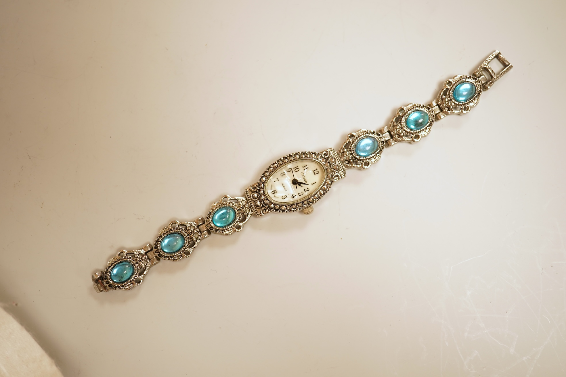 A small collection of assorted costume jewellery and other items including a cut steel shoe buckle, bracelets, chains, pair of silver and enamel oval cufflinks, etc.